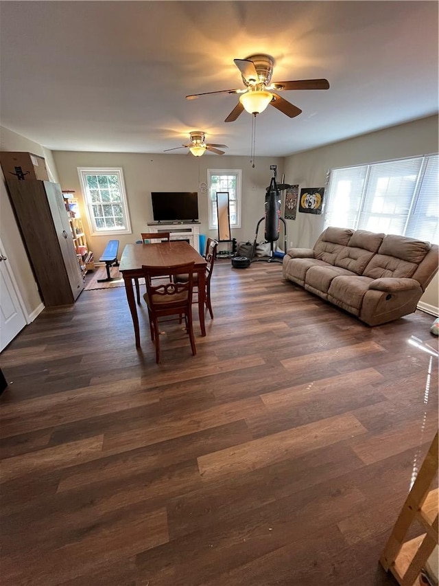 dining space featuring dark hardwood / wood-style floors and ceiling fan