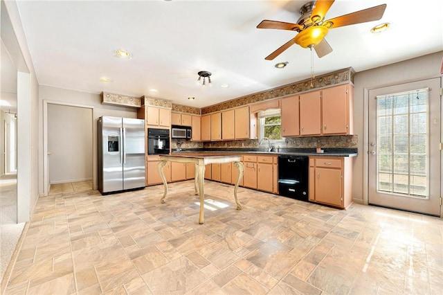 kitchen with backsplash, ceiling fan, sink, and black appliances