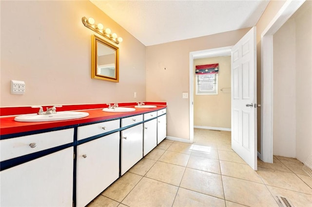 bathroom featuring vanity and tile patterned flooring