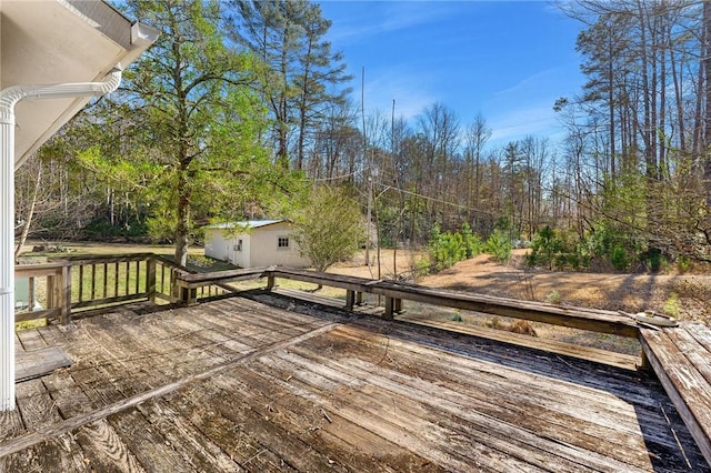 wooden deck with an outbuilding