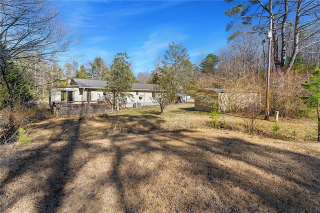 view of yard featuring a wooden deck