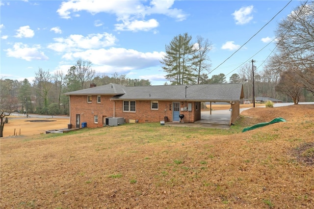 back of house featuring a yard and a patio area