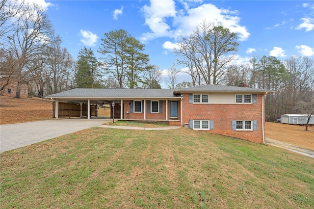 view of front of property with a carport and a front lawn