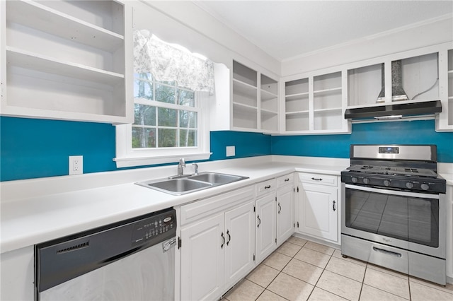 kitchen featuring sink, light tile patterned floors, stainless steel appliances, and white cabinets