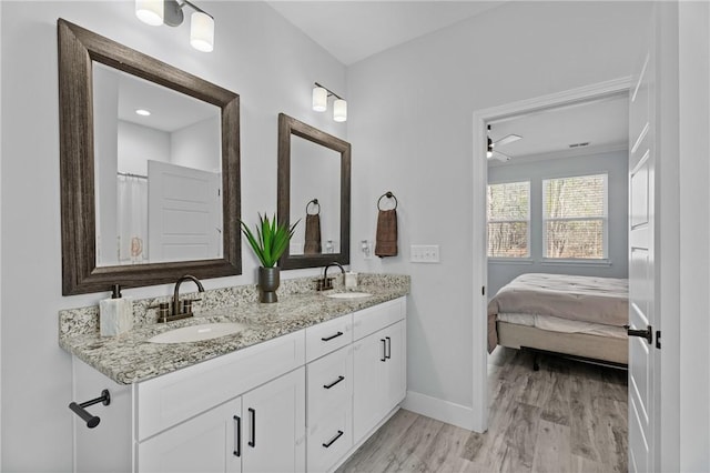 bathroom with vanity and hardwood / wood-style flooring