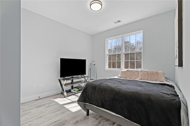 bedroom with light hardwood / wood-style floors