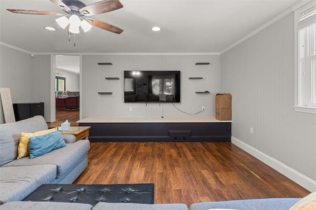 living room featuring ornamental molding, ceiling fan, and dark hardwood / wood-style flooring