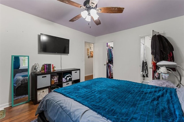 bedroom with hardwood / wood-style floors and ceiling fan