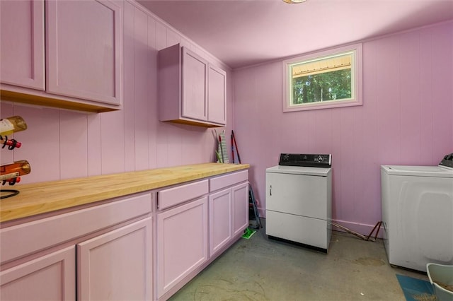 laundry area featuring cabinets and separate washer and dryer