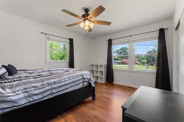 bedroom featuring ceiling fan and wood-type flooring