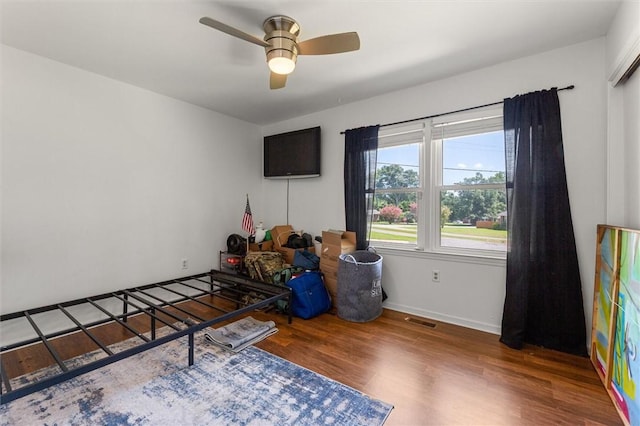 game room featuring ceiling fan and dark hardwood / wood-style flooring