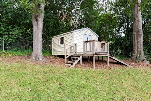 view of outdoor structure featuring a lawn