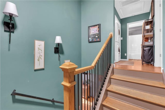 staircase featuring attic access