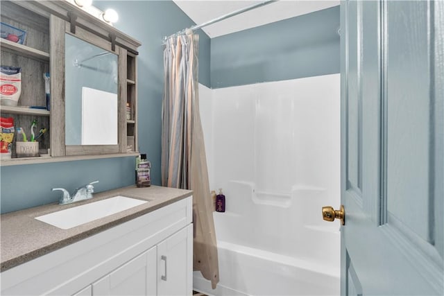 bathroom with shower / bath combo with shower curtain and vanity