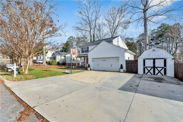 view of side of property with an outbuilding, an attached garage, a yard, driveway, and a storage unit