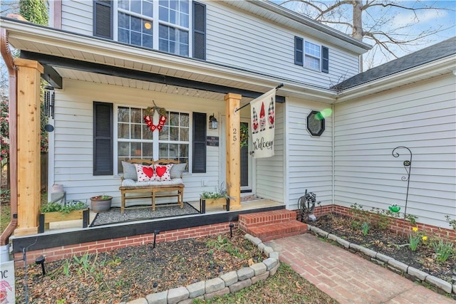 property entrance featuring a porch