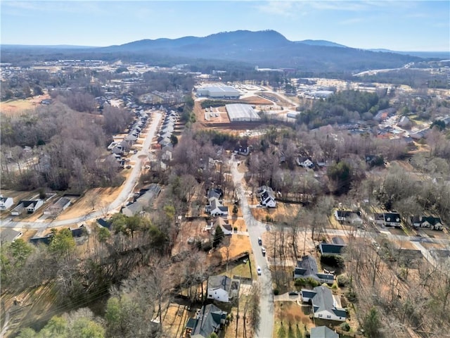 drone / aerial view featuring a residential view and a mountain view