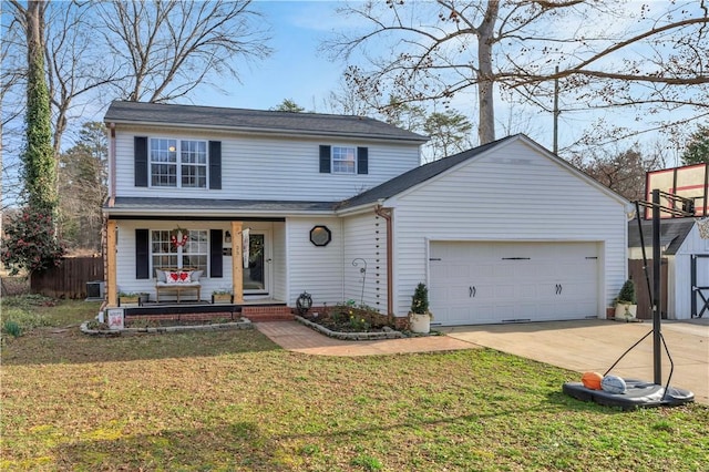 traditional home featuring a garage, a front yard, covered porch, and concrete driveway