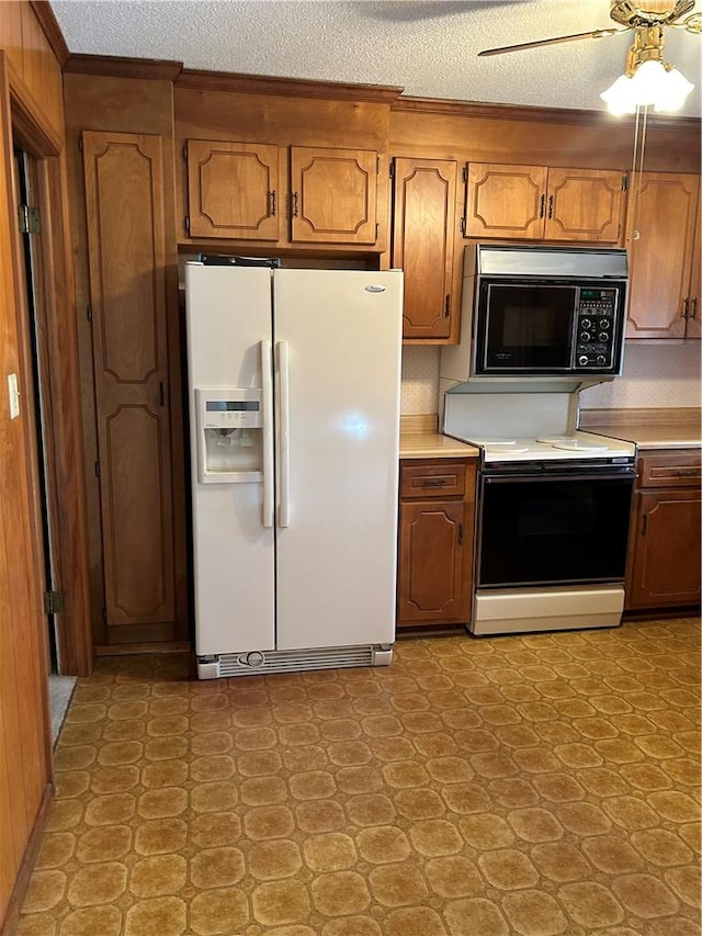 kitchen featuring white refrigerator with ice dispenser, light countertops, electric range oven, brown cabinetry, and black microwave