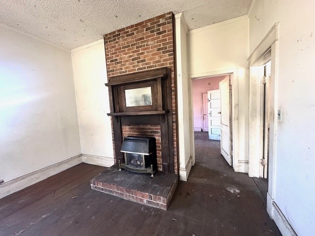 unfurnished living room with dark hardwood / wood-style flooring, crown molding, a wood stove, and a textured ceiling