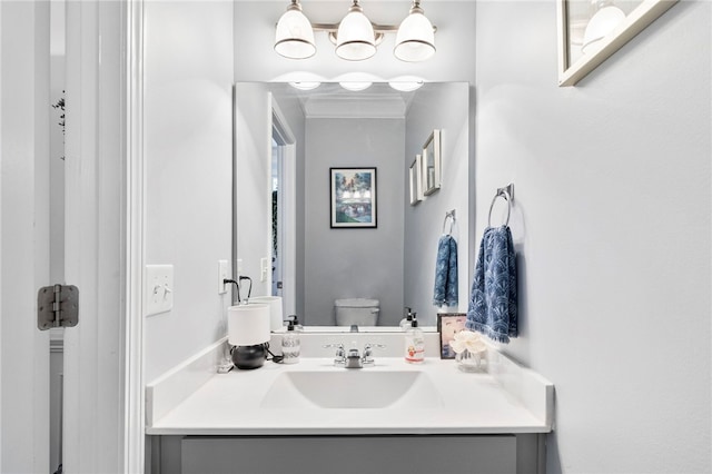 bathroom featuring toilet and vanity