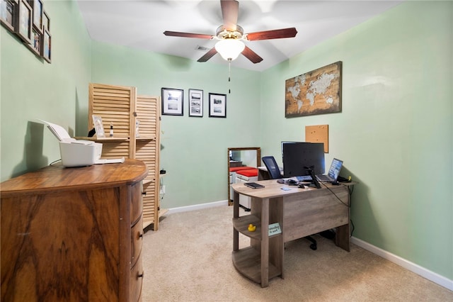 office featuring ceiling fan and light carpet