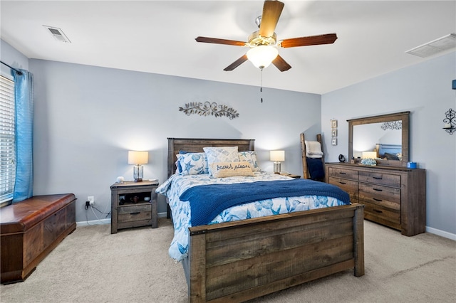 bedroom featuring ceiling fan and light carpet