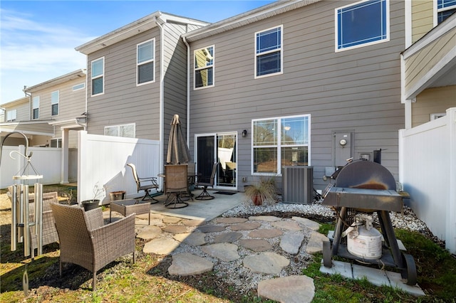 back of property with a patio and central AC unit