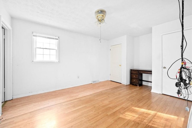 unfurnished bedroom featuring hardwood / wood-style flooring