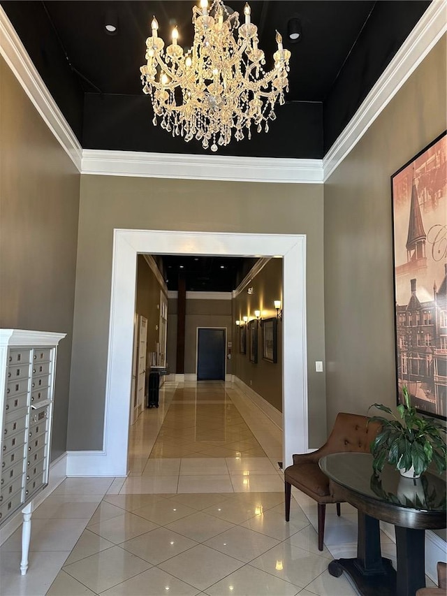 hallway with a mail area, tile patterned flooring, and an inviting chandelier