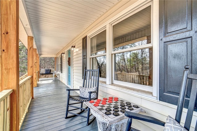 wooden terrace featuring a porch