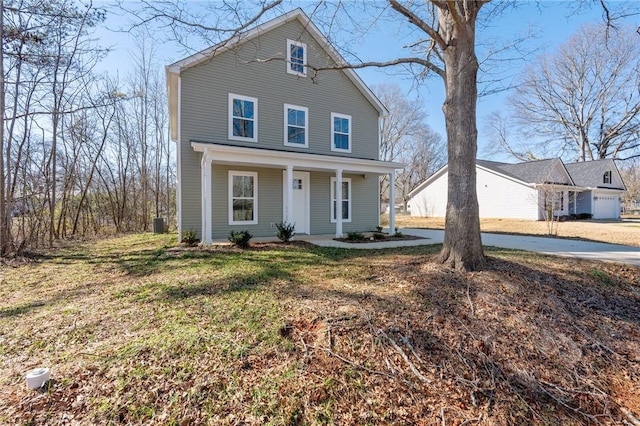 view of property with a front lawn and a porch