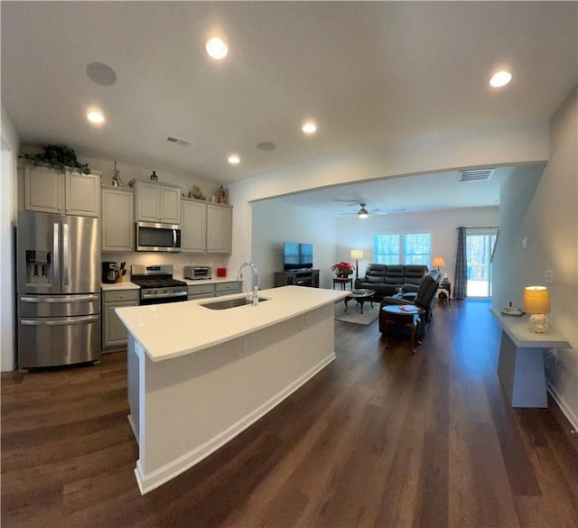 413 Sonoma Ct, Seneca, SC 29678 - kitchen featuring stainless steel appliances, dark wood finished floors, open floor plan, recessed lighting, and light countertops