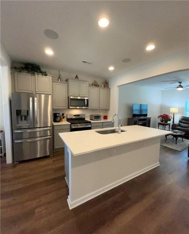 413 Sonoma Ct, Seneca, SC 29678 - kitchen with stainless steel appliances, dark wood-type flooring, ceiling fan, open floor plan, and recessed lighting