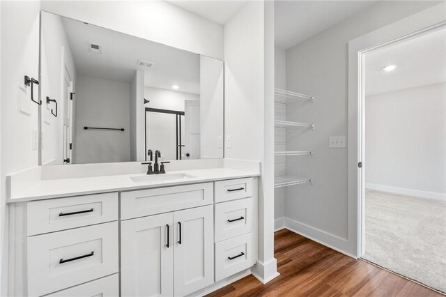 104 Norbert Ln, Anderson, SC 29624 - bathroom with hardwood / wood-style floors, a shower with shower door, and vanity