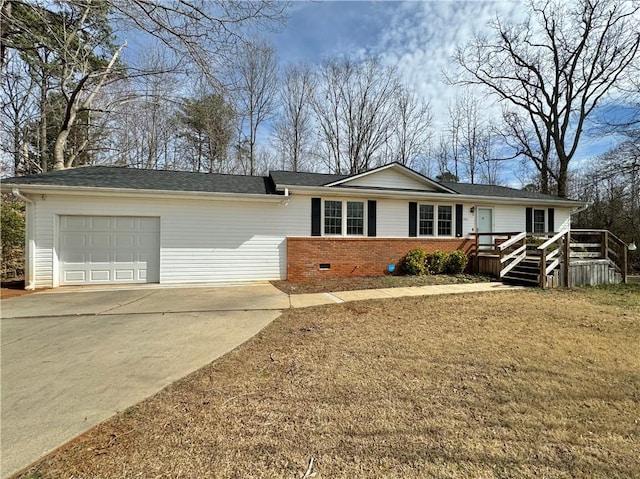 ranch-style home with a front lawn and a garage