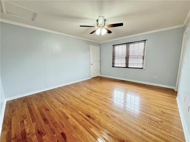 spare room featuring ornamental molding, ceiling fan, and light hardwood / wood-style flooring