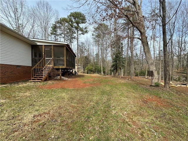 view of yard with a sunroom