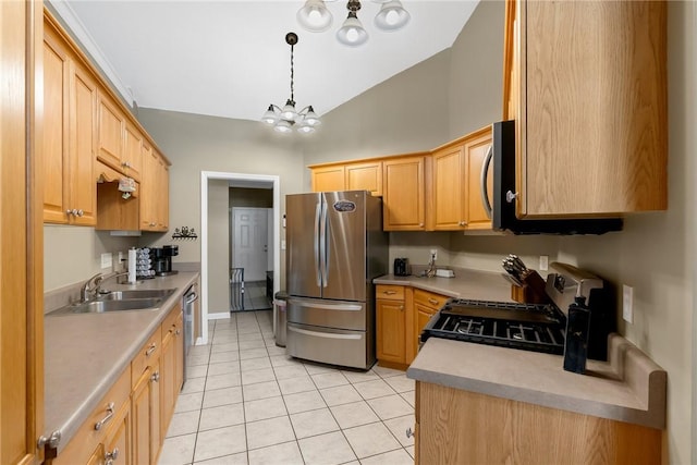 kitchen featuring an inviting chandelier, light tile patterned floors, sink, stainless steel appliances, and hanging light fixtures