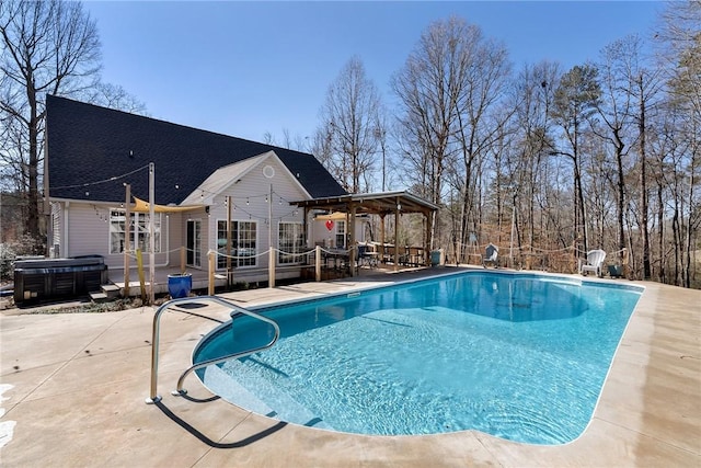 view of pool featuring a patio area and a jacuzzi