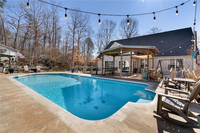 view of pool featuring a patio area and ceiling fan