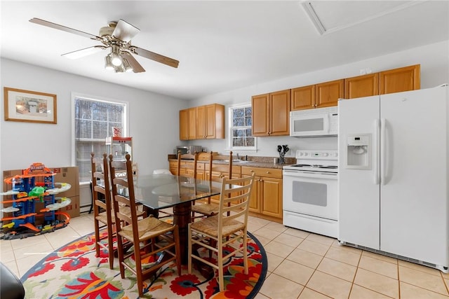 kitchen featuring white appliances, light tile patterned floors, and ceiling fan