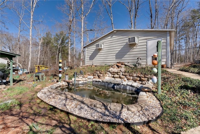 view of yard with a wall mounted AC