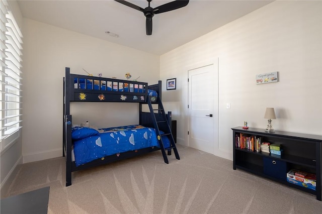 carpeted bedroom featuring ceiling fan