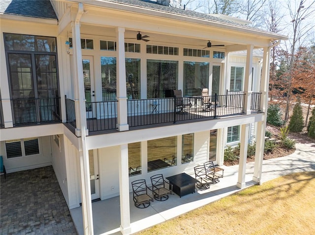 back of property with a patio area and ceiling fan