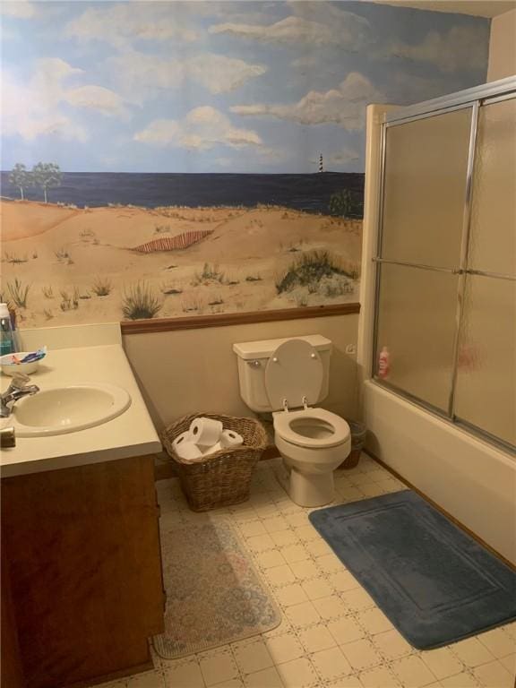 full bathroom featuring toilet, wallpapered walls, bath / shower combo with glass door, and vanity