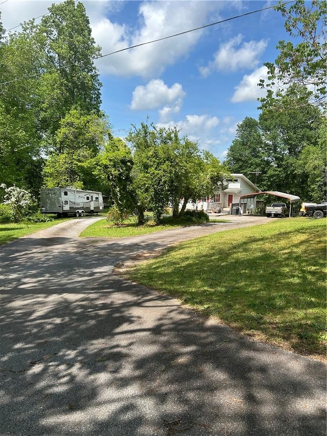 view of road with driveway