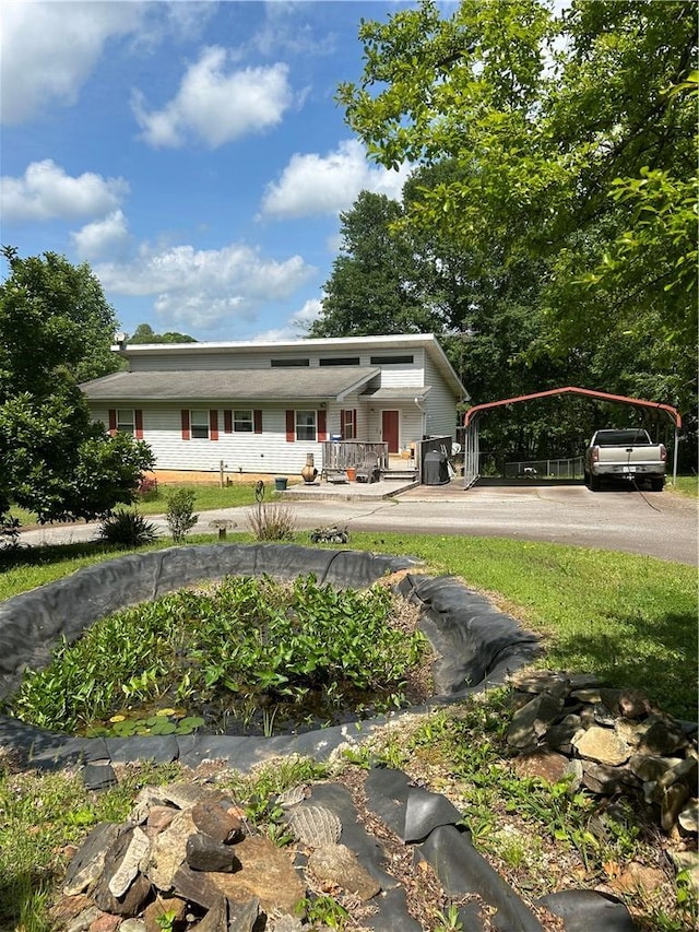 view of front facade with a detached carport