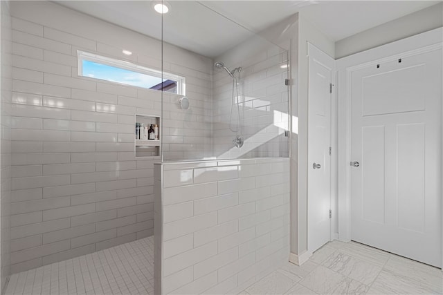 bathroom featuring tiled shower