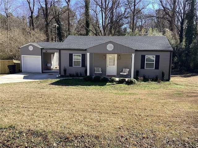 ranch-style house with a garage, covered porch, and a front yard